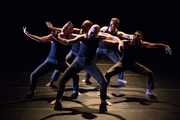 A group of male dancers in blue