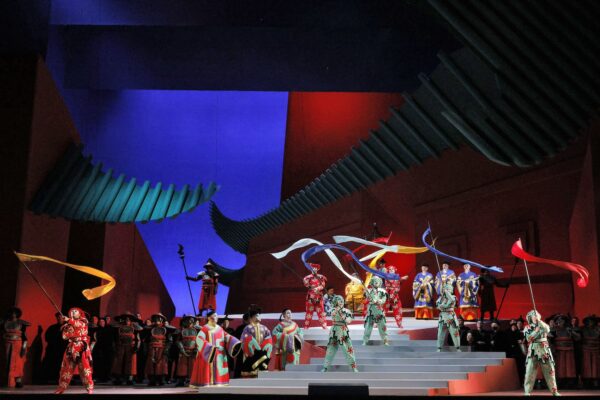 Dancers and acrobats along a staircase from LA Opera's Turandot, featuring a set designed David Hockney