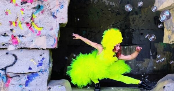 A dancer in bright yellow