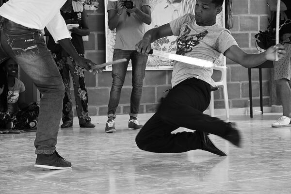 Young men parry with machetes