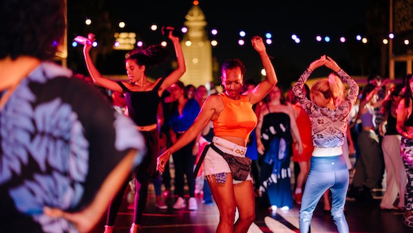 Dancers with city hall in background