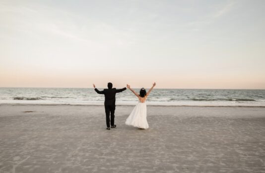 bride and groom on beach