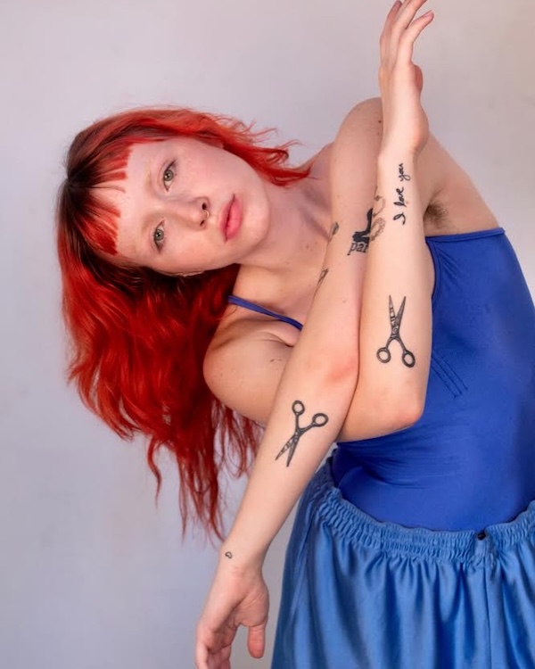 A red headed dancer in blue