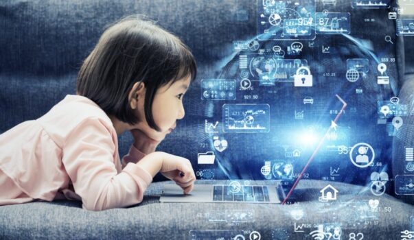 Girl lying on stomach in front of laptop with AI imagery floating about.