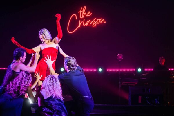 A lady in red is lifted