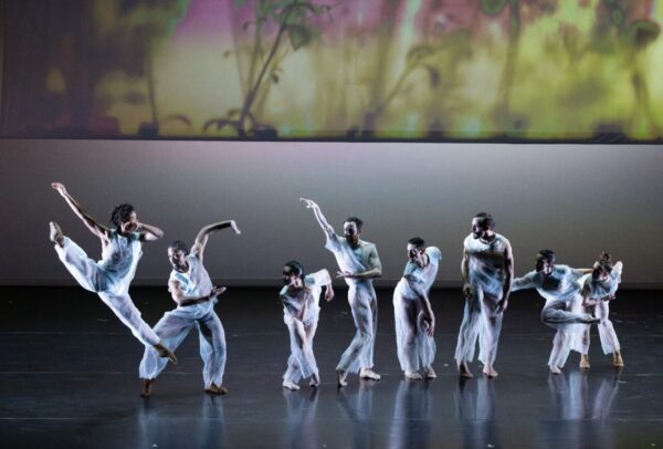 A group of dancers in white