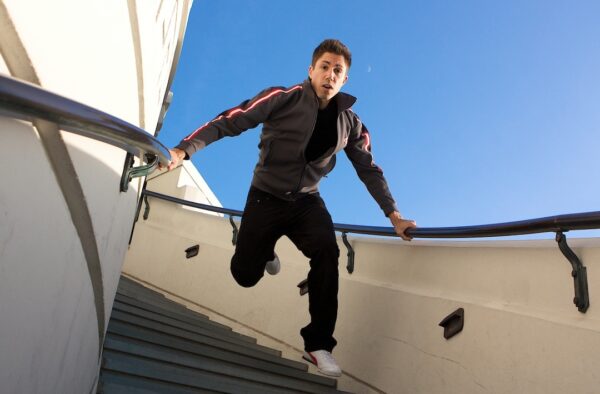 A dancer comes down stairs