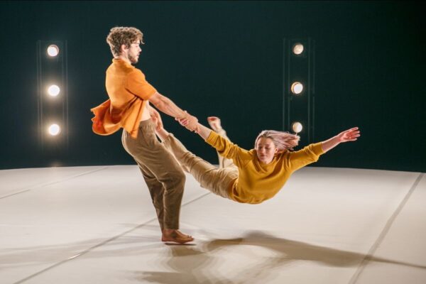A man swings a woman