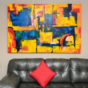 Colorful wall art above sofa.
