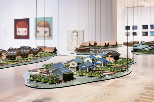 Tiffany Chung, stored in a jar: monsoon, drowning fish, color of water, and the floating world, 2010–11, installation view, Plexiglas, wood veneer, plastic, aluminum, paint, steel, cable, foam, copper wire; Post Vidai Collection, courtesy of the artist. In left background, Yoshitomo Nara, A Sinking Island Floating in a Sea Called Space, No. 1 and 2, 2024, acrylic on canvas; No. 1, courtesy of the artist, Yoshitomo Nara Foundation, BLUM, and Pace Gallery; No. 2, private collection.