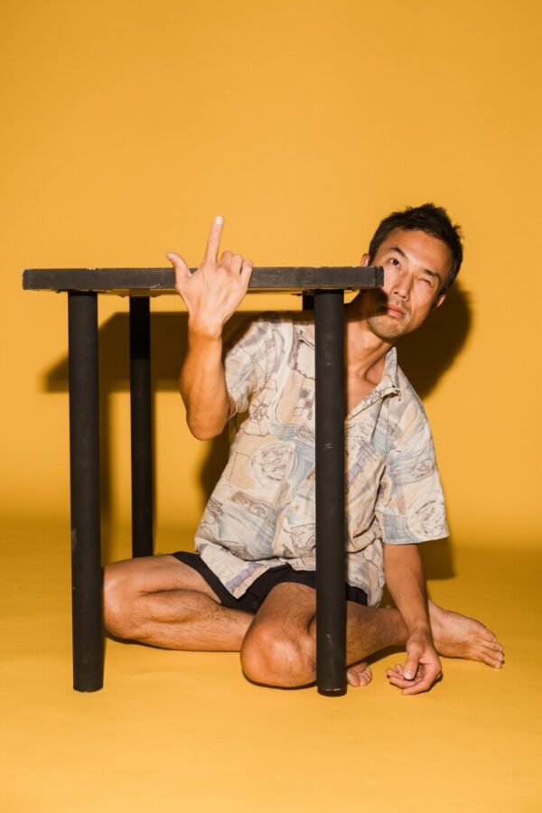 A dancer under a chair