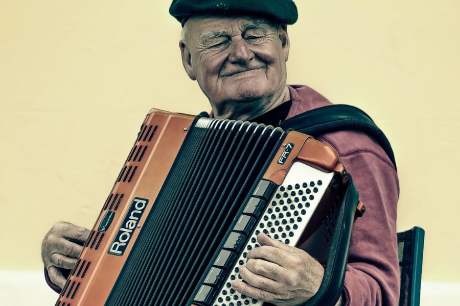 man playing the button accordion