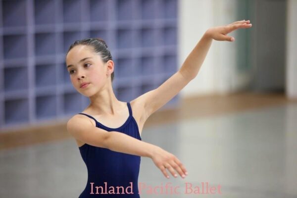 A ballet student strikes a pose