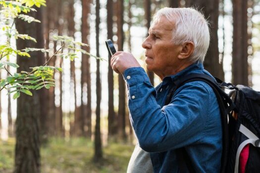 Elderly man in nature using Life Alert