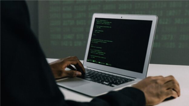 Man hacking into laptop.