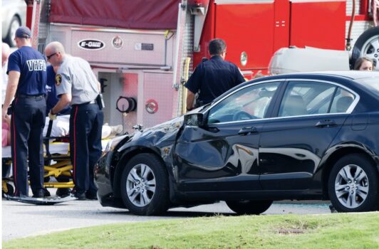 Accident of a car in front of fire truck.