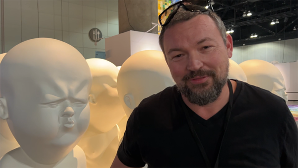 Portrait of the artist with his work