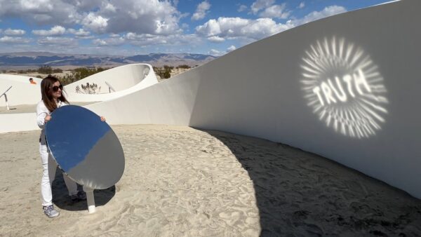 The artist holding a mirror