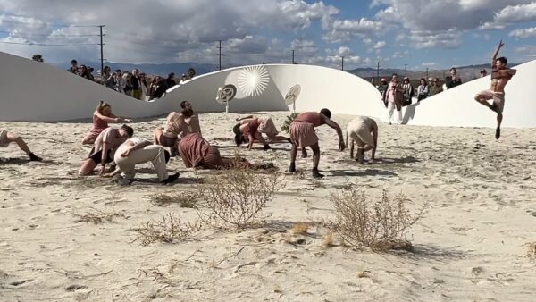dancers by the sculpture