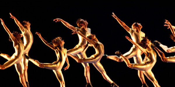A group of dancers leaps