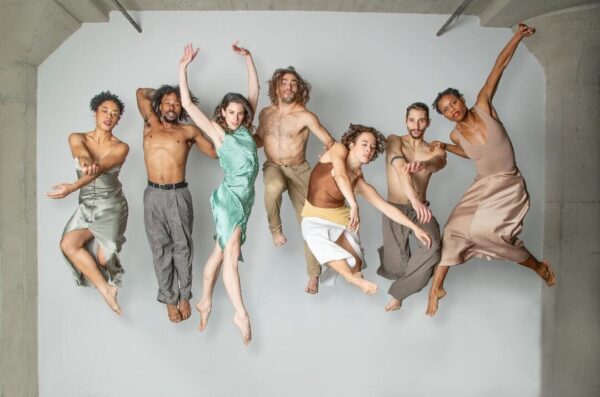Dancers against a white backdrop