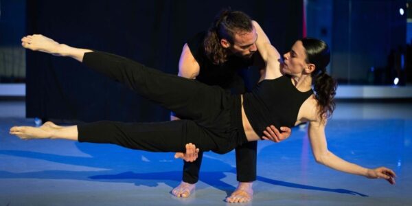 A male dancer holds a female dancer