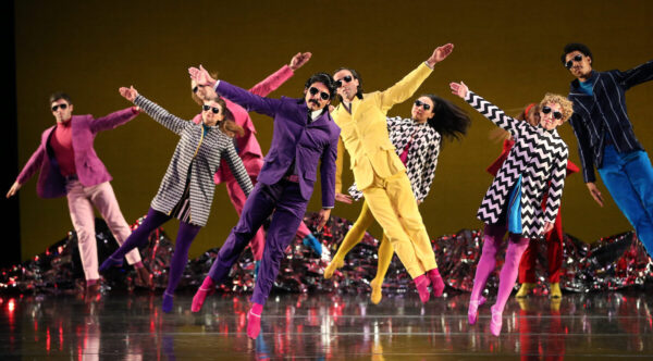 Dancers in colorful jackets