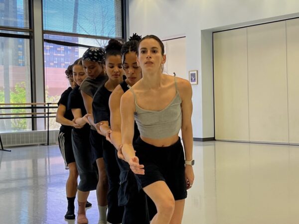 A diagonal line of dancers