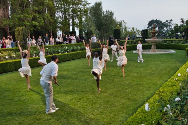 Dancers playing croquet in Gatsby Redux