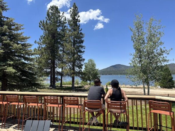 A couple looking out over Big Bear Lake.