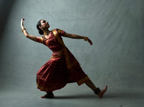 A South Asian dancer strikes a pose