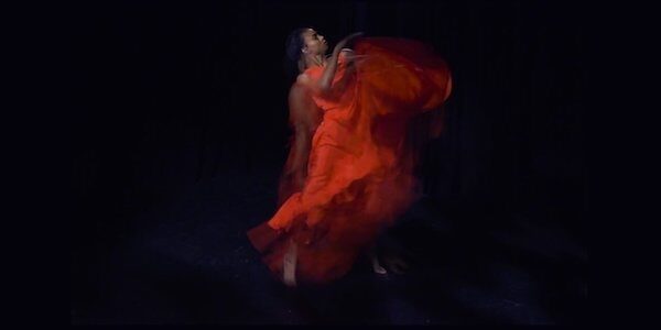 A dancer in red