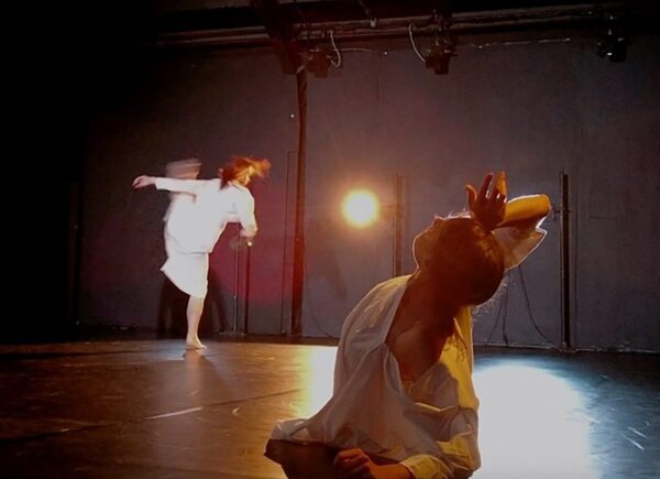 Two dancers with a light