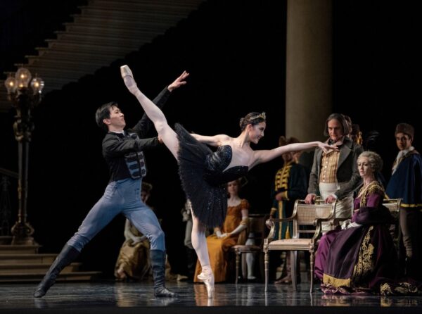 A dancer in a black tutu in arabesque for San Francisco Ballet.