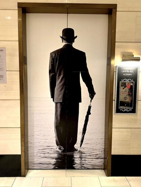 The hotel's elevators, showing a 1920s man with an umbrella standing in a pool of water at the London West Hollywood