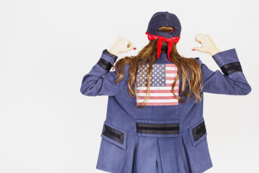Urban woman with american flag on jacket