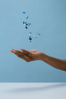 Person Catching Pills