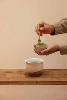 Person Scooping Match Powder using a Wooden Spoon