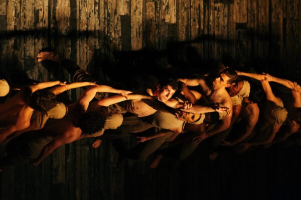Overhead shot of dancers' arms