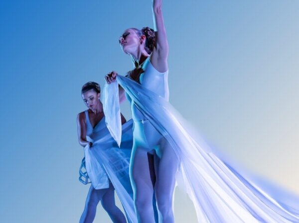 Two dancers with long white drape