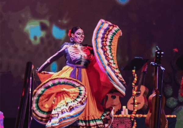 A folkloric dancer twirls full skirt