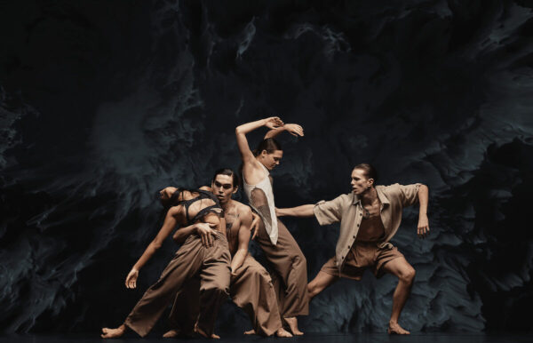 Four dancers in brown