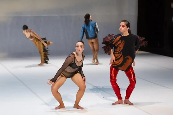 Four dancers in bird-like postures