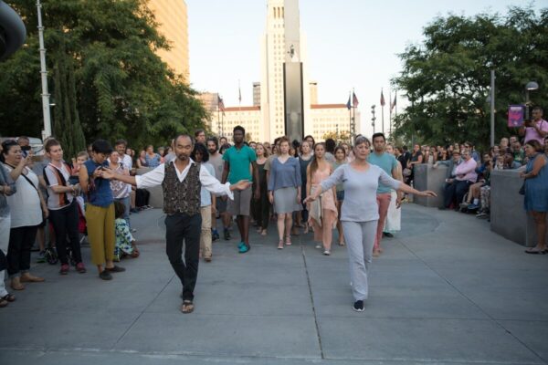 A dancer leads a parade