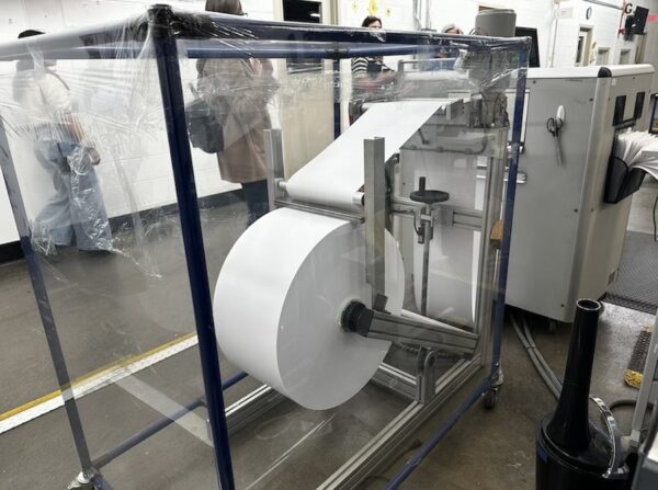 A Braille printing machine showng a large roll of paper at the American Printing House for the Blind 