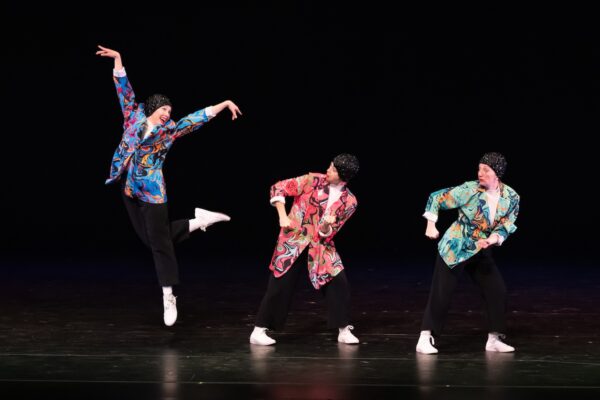 The Seaweed Sisters. Photo by Jingzi Zhao. One girl in blue jumps, two others look on