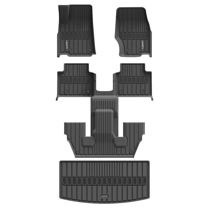 A full set of black molded rubber car floor mats and cargo liner arranged on a white background