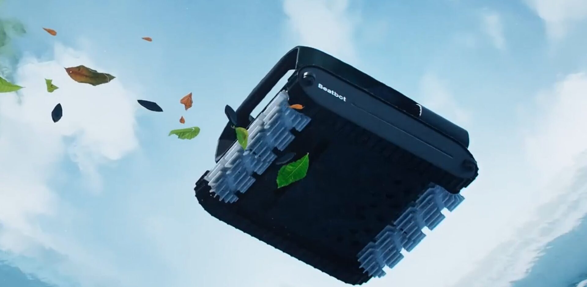 Black Beatbot pool cleaner with tank treads surrounded by floating leaves against a blue sky