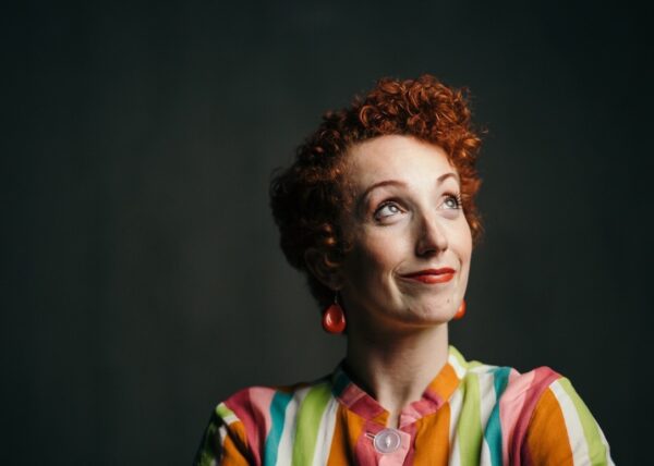 A redheaded woman with curly hair