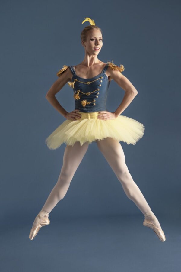 Dancer in blue top and yellow tutu